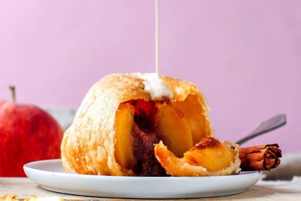 Dutch apple dumpling poured with milk.