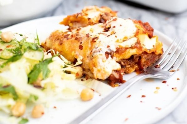 Lasagna on a plate with a fork.