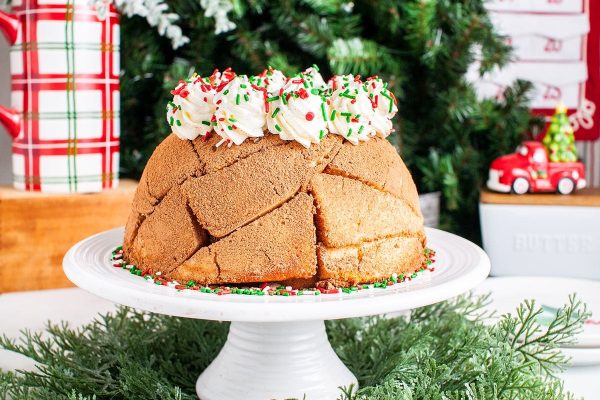 A traditional Christmas bundt cake on a white plate.