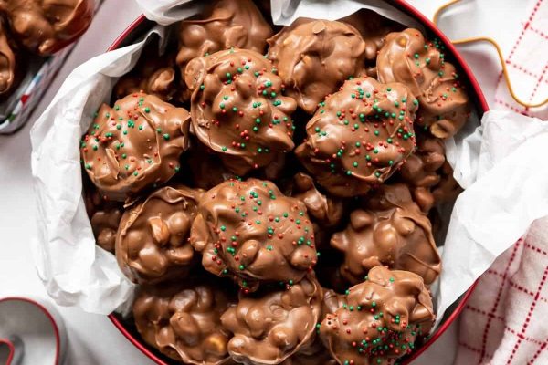 Chocolate peanut butter cookies in a bowl with sprinkles.