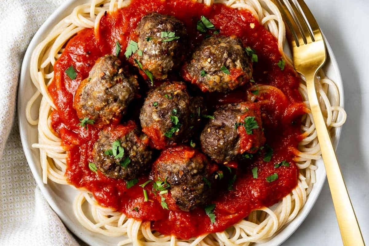 Picky Eater Recipes - Delicious spaghetti with meatballs and sauce on a plate.