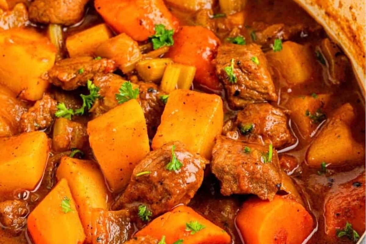 Hawaiian-inspired stew with meat and vegetables in a pot, perfect for a luau.