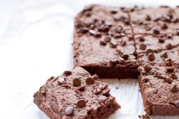 A slice of chocolate brownie on a piece of paper, perfect for those looking for delicious brownie recipes.
