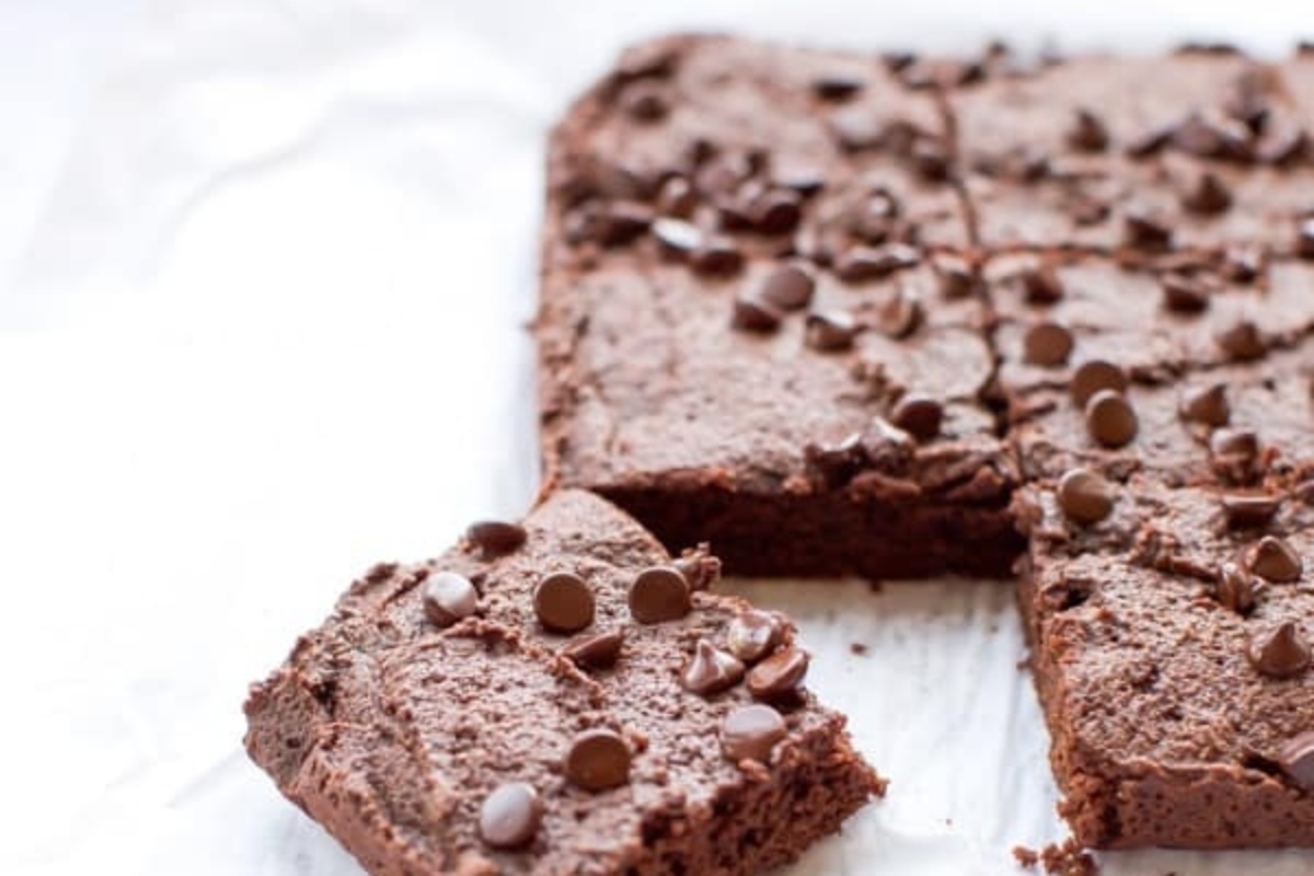 A slice of chocolate brownie on a piece of paper, perfect for those looking for delicious brownie recipes.