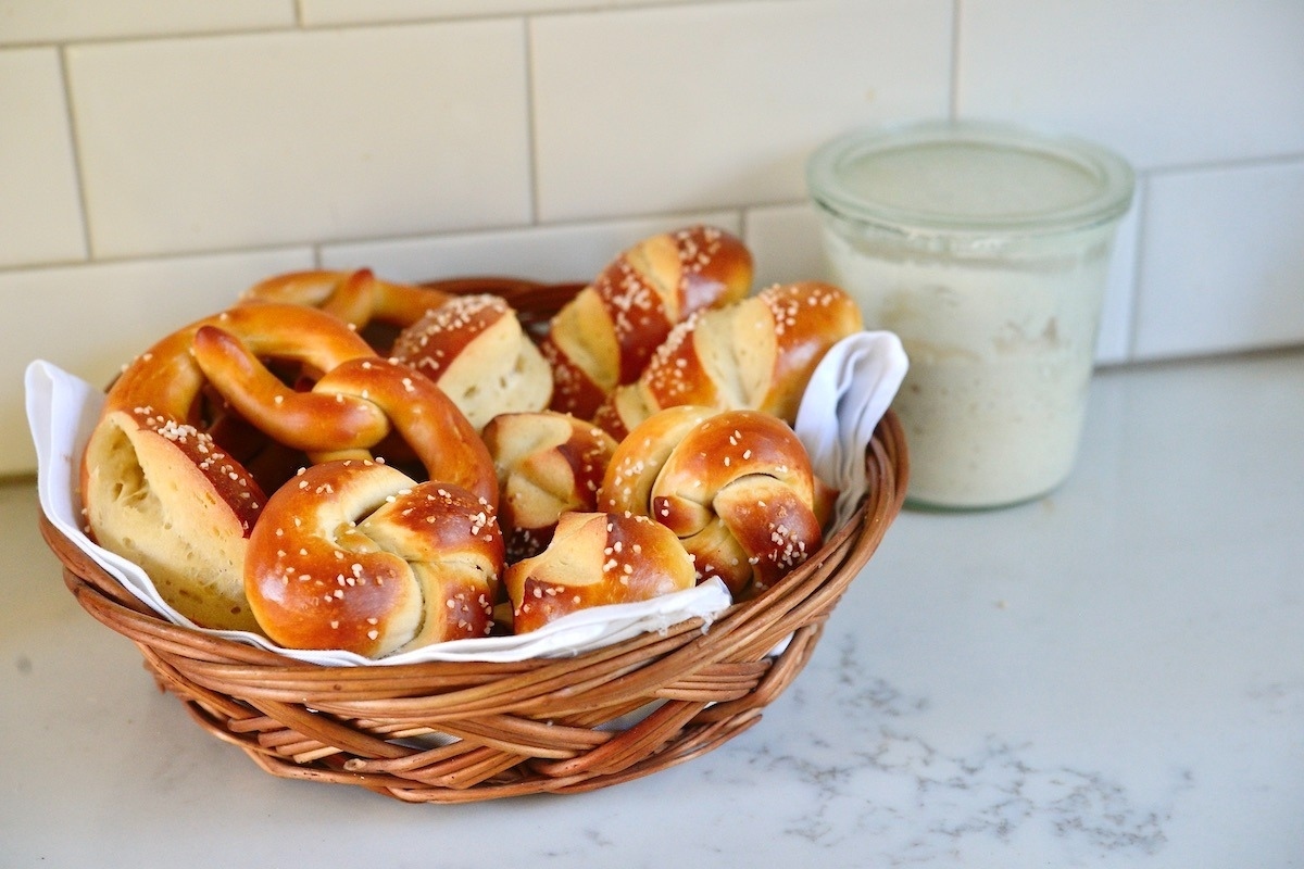 Pretzels in a basket on a counter.