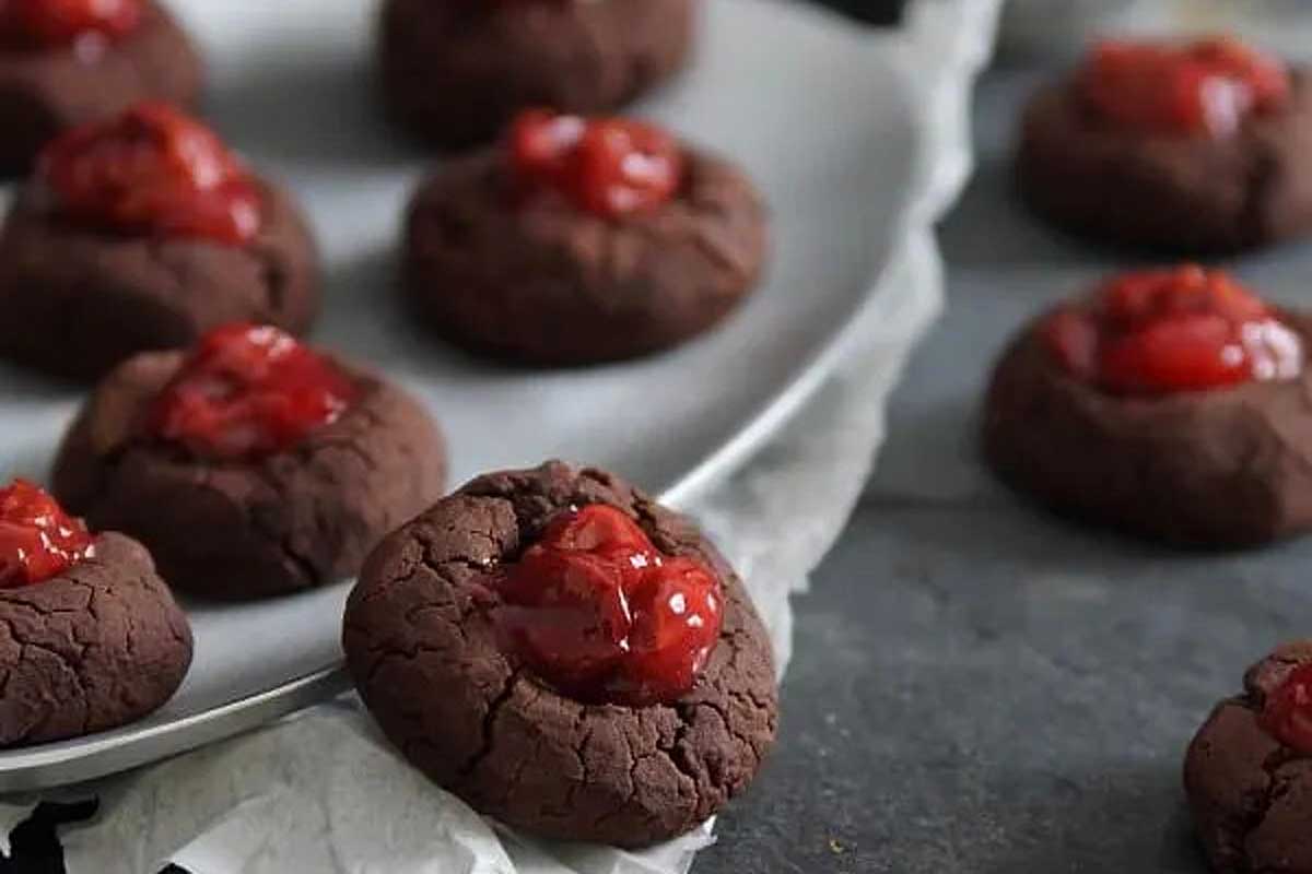 Tart Cherry Fudge Thumbprint cookies on a plate.