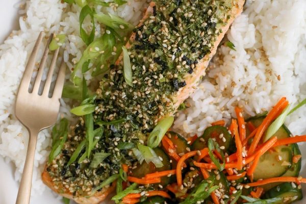 An appetizing plate of Asian-inspired salmon and rice, served with a fork.