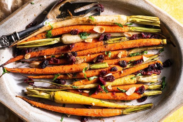 Cheap roasted carrots with cranberries - perfect for Thanksgiving or potluck dishes.