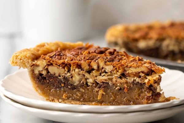 A slice of pecan pie on a plate.