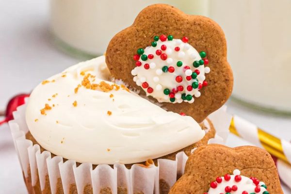 Christmas cupcakes with icing and sprinkles.