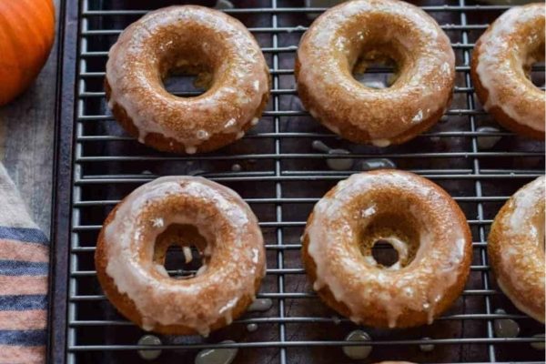 Apple Cider donuts on a cooling rack.