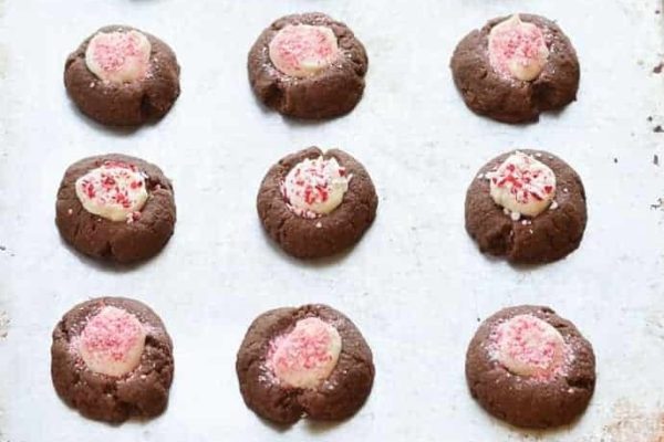 Festive Christmas cookies on a baking sheet, perfect for gift giving.
