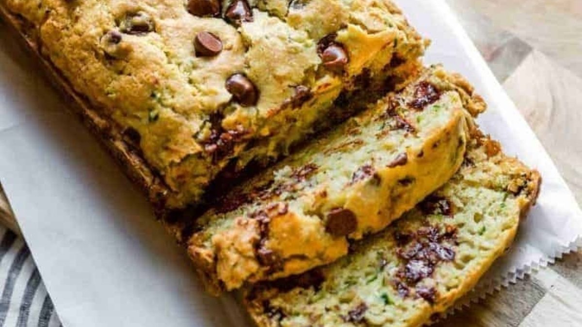 A chocolate chip zucchini bread recipe on a cutting board.
