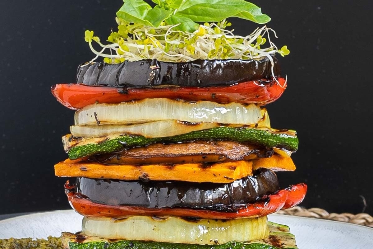 A stack of grilled vegetables on a plate, perfect for Thanksgiving.