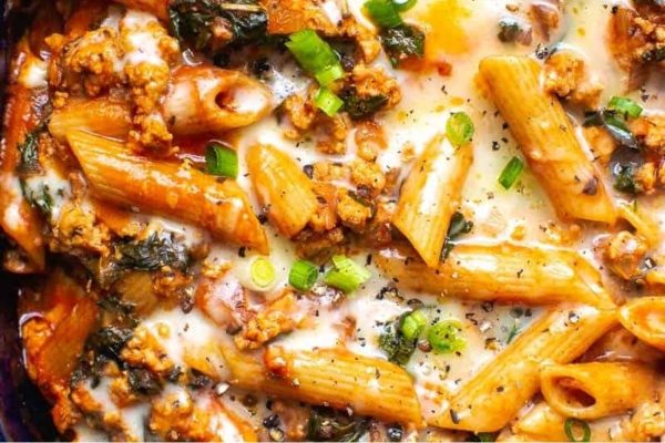 A kid-friendly dish of pasta with meat and spinach that parents love.