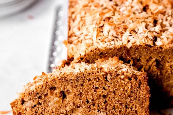 A slice of banana bread on a plate.