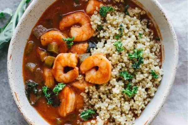 Shrimp and cajun sauce in a bowl.