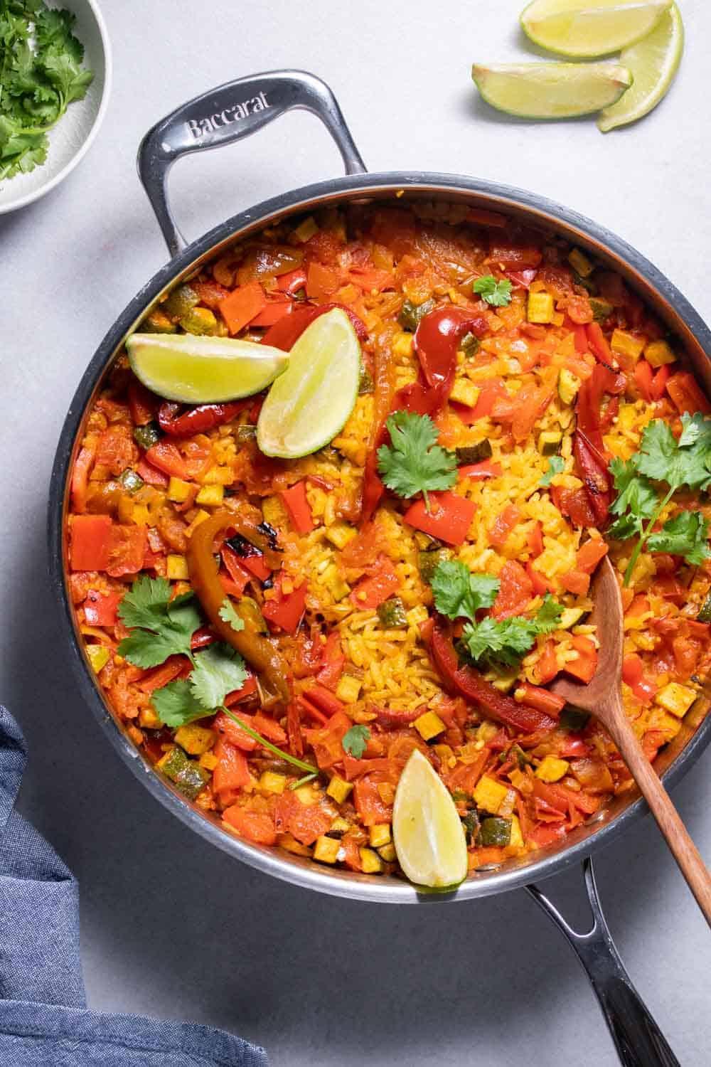 A pan with a dish of rice and vegetables.