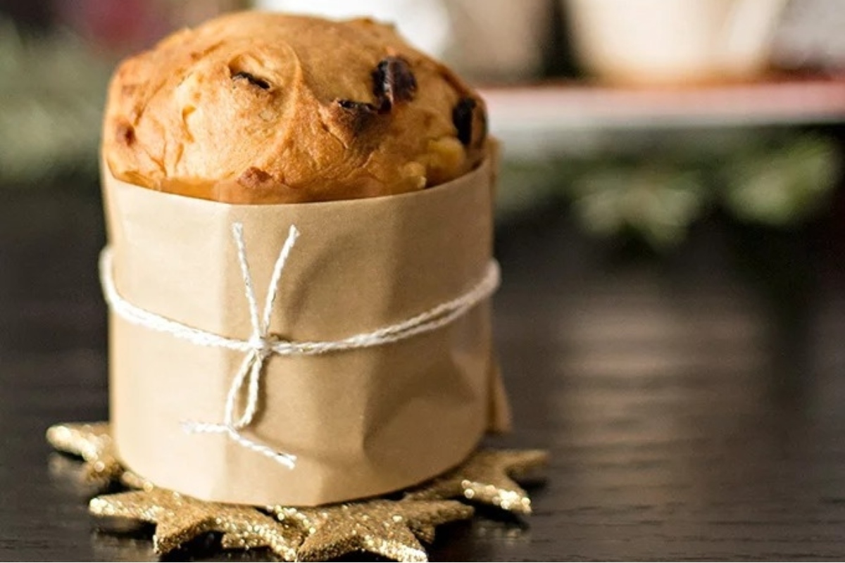 An Italian Dessert in a brown paper bag on a table.