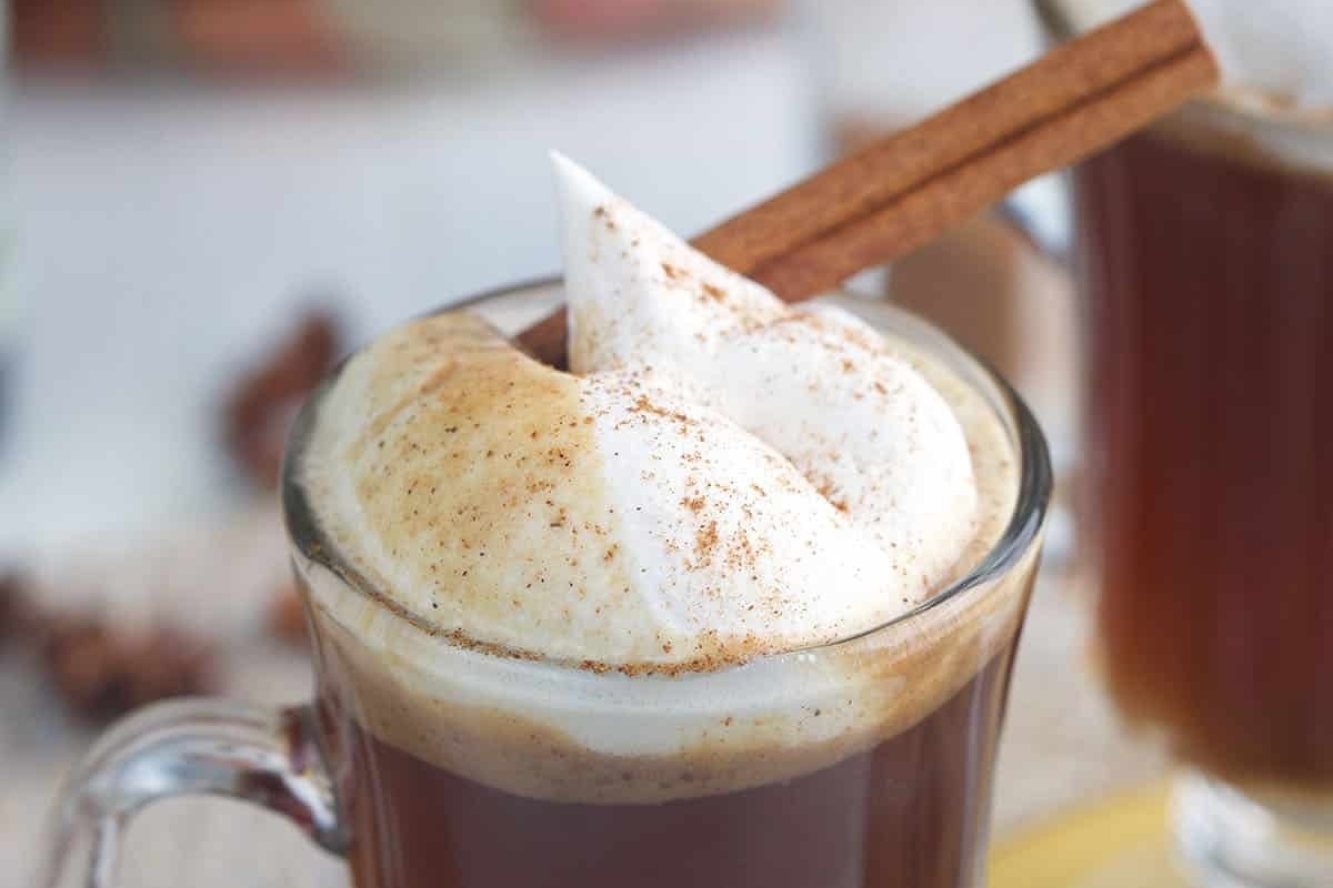 A festive cup of rum with aromatic cinnamon and a dollop of fluffy whipped cream.