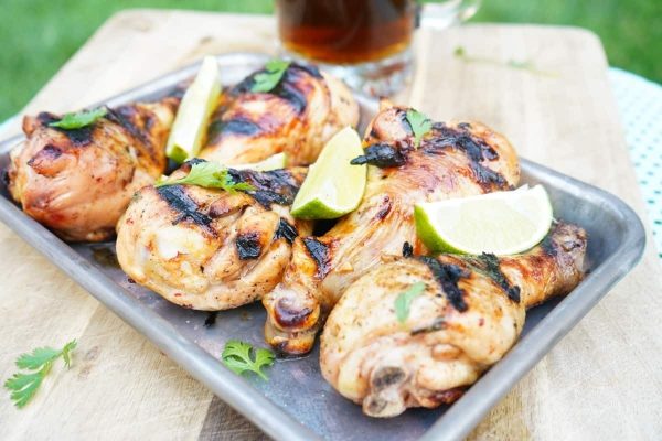 Chicken drumsticks on a plate.