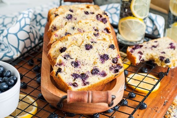 Blueberry lemon bread on a wooden cutting board.