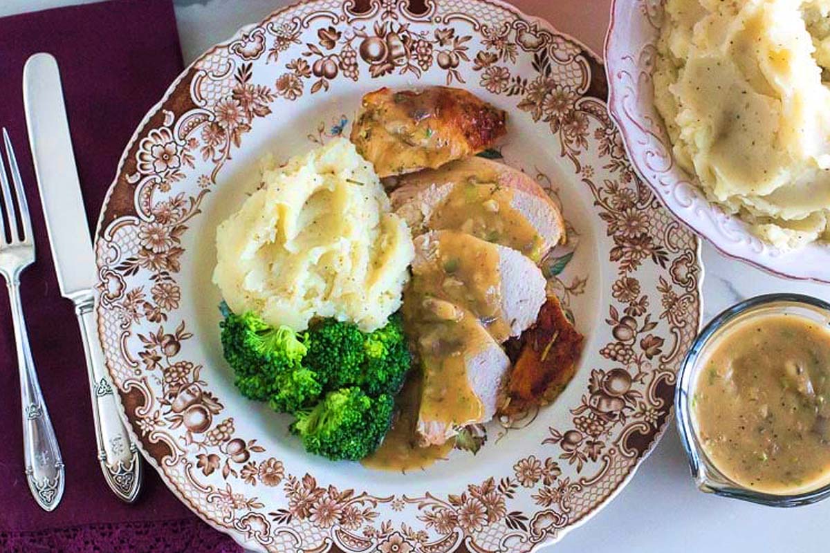 Slow Cooker Thanksgiving plate with mashed potatoes and gravy.