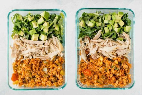 Two glass containers with food in them.