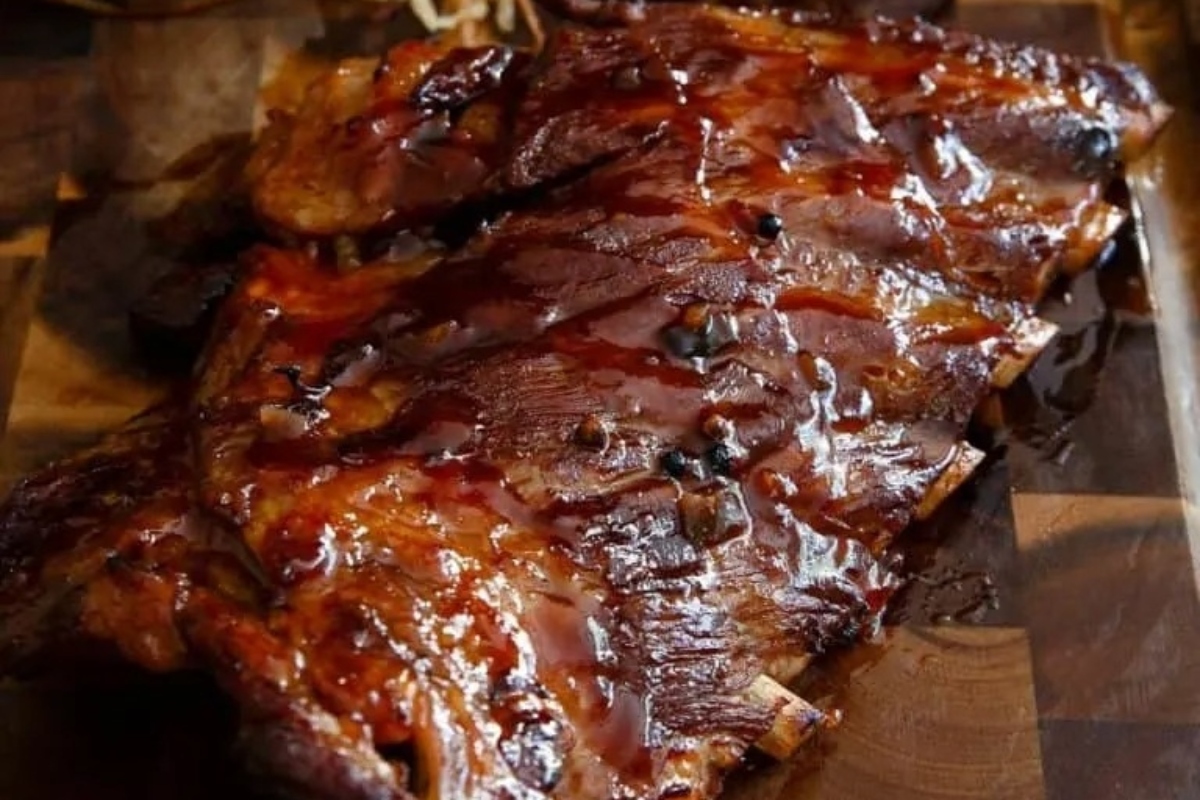Delicious BBQ ribs recipes displayed on a cutting board.