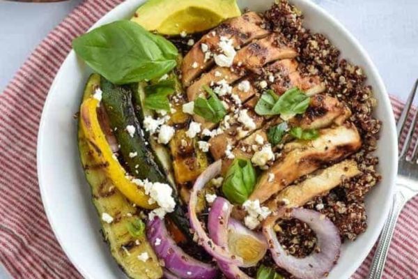 Quinoa salad with chicken and vegetables, perfect for meal prep lunches.