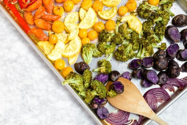 Meal Prep of rainbow roasted vegetables on a baking sheet.