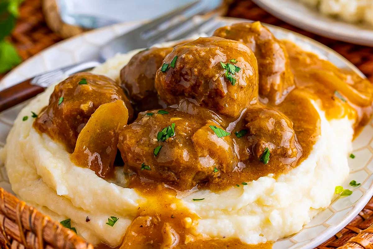 Swedish meatballs on mashed potatoes with gravy.