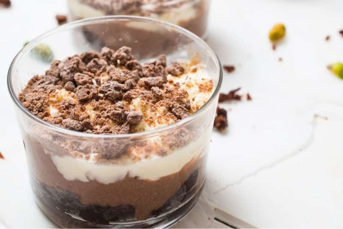 Trifles with chocolate pudding, whipped cream, and pistachios.