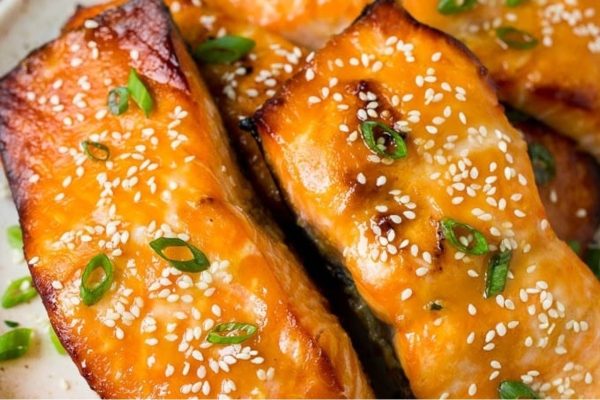 Asian salmon is a flavorful seafood dish that features tender salmon fillets coated in sesame seeds. Served on a plate, this recipe showcases the fusion of Asian flavors with the delicious nuttiness of sesame
