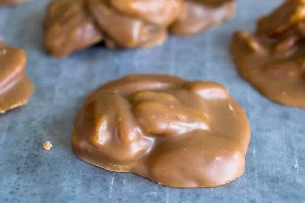 Peanut butter caramels on a baking sheet.