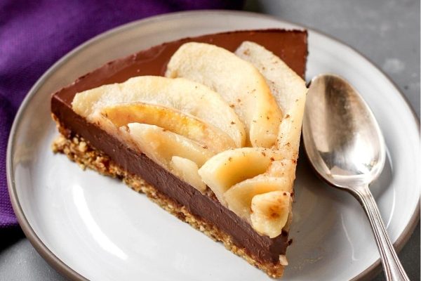 A slice of chocolate apple pie on a plate.