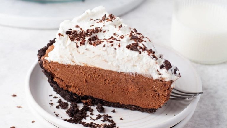 A slice of chocolate ice cream pie on a plate.