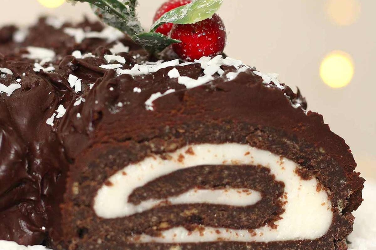 A Christmas cake with a sprig of holly.