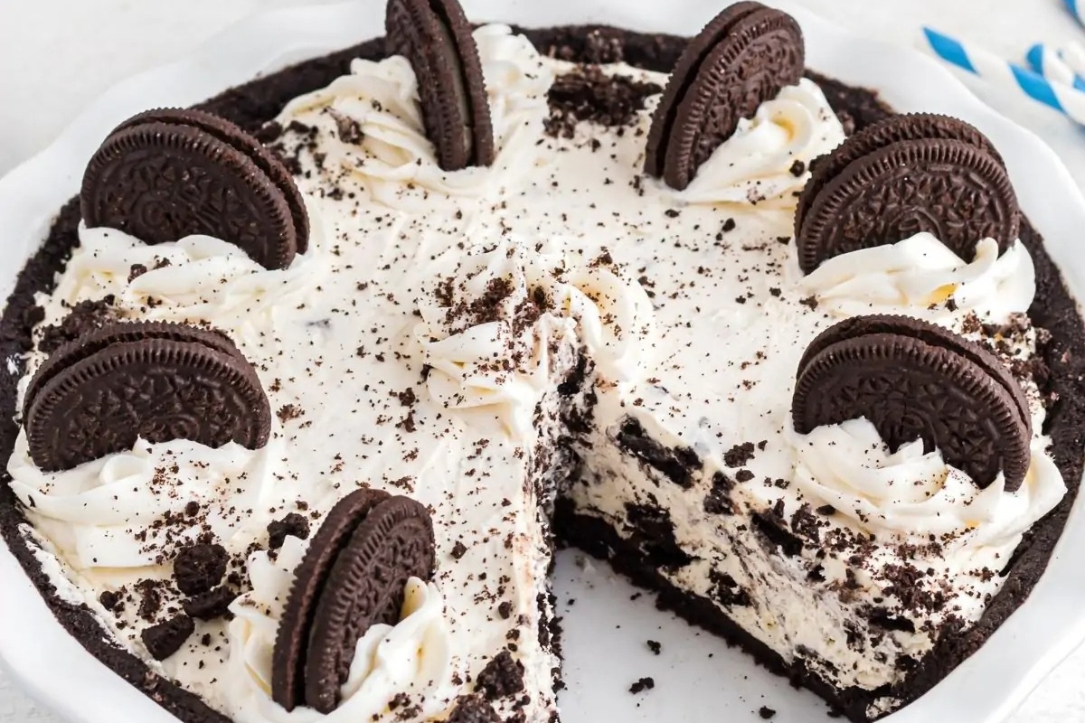 Oreo ice cream pie on a white plate with Oreo Recipes.