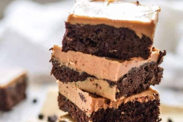 A decadent stack of chocolate peanut butter brownies, just waiting to be devoured.