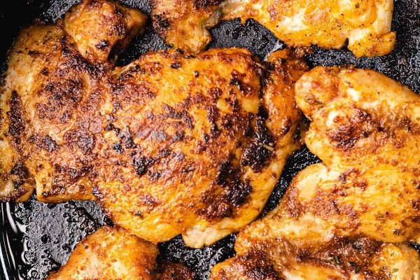 Roasted chicken breasts in a skillet.