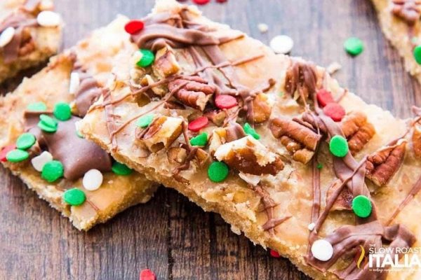 Christmas cookie bars with pecans and sprinkles.