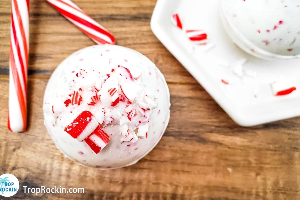 A white bowl filled with a delightful assortment of candy canes.