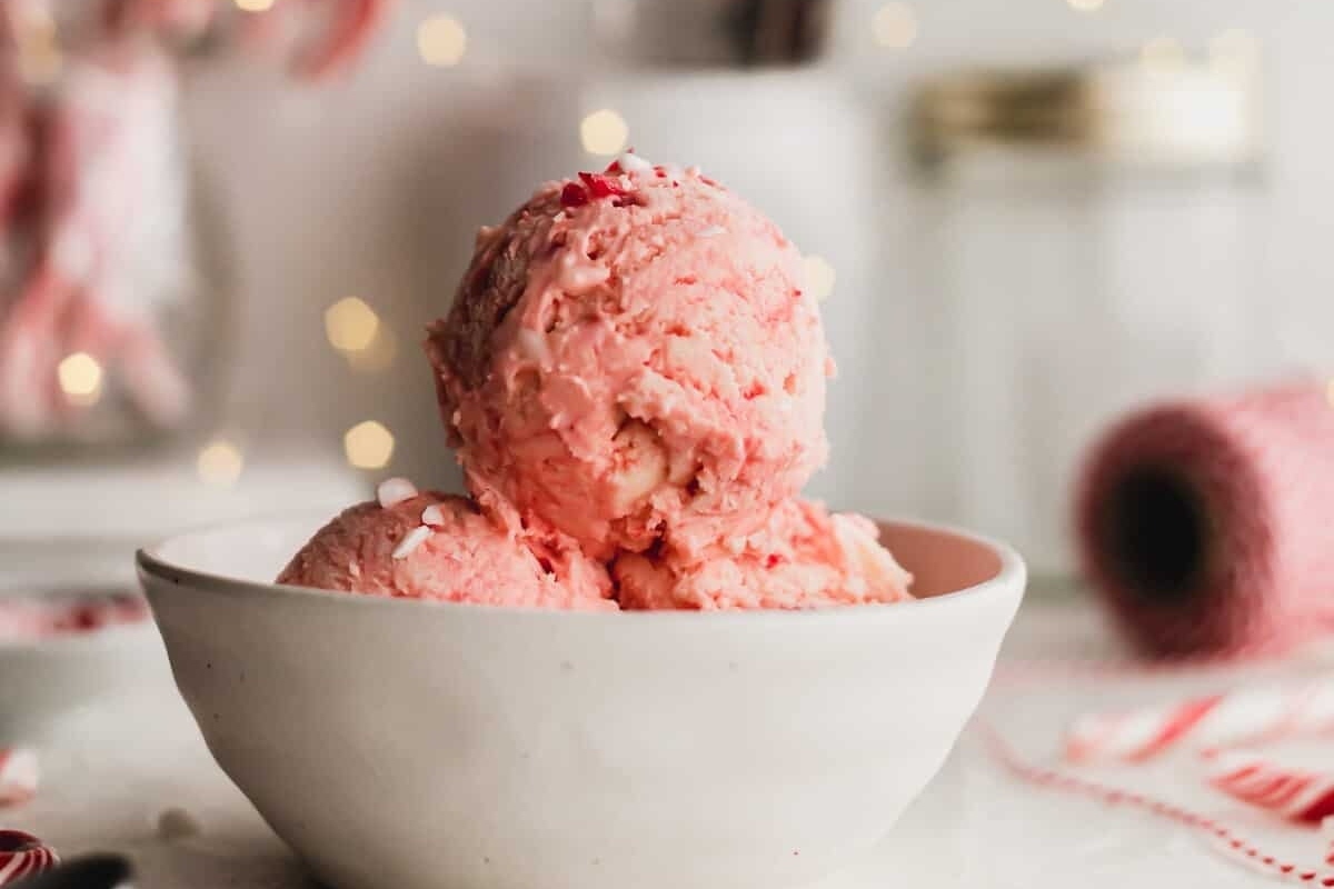 Candy cane ice cream served in a bowl, creating a delightful treat for those seeking candy cane recipes.
