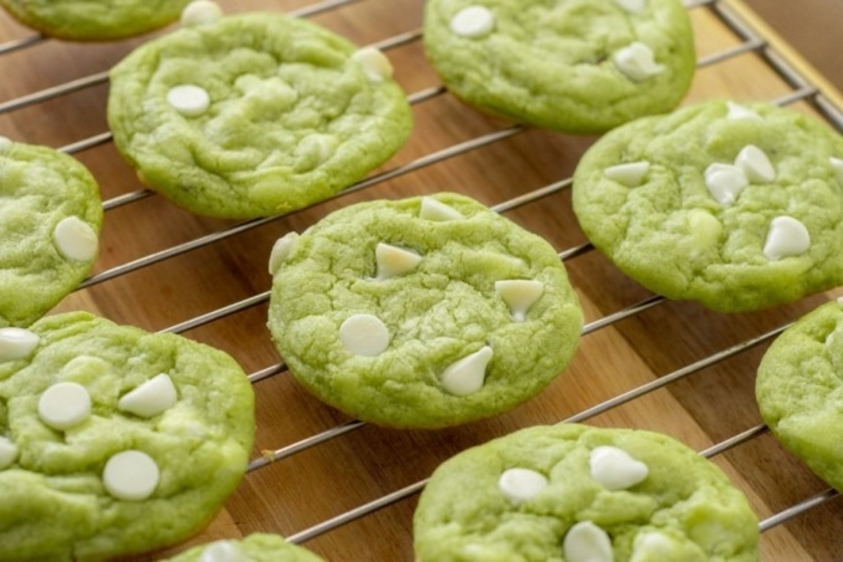 Green cookies on a cooling rack.