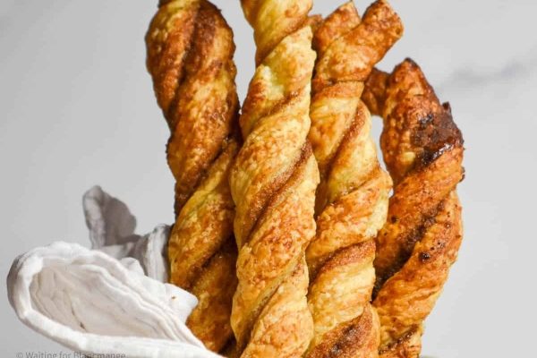 French bread sticks in a white bowl.