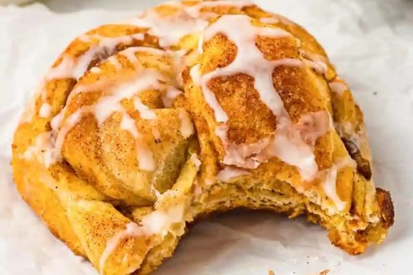 A cheap cinnamon roll smothered in icing, perfect for Thanksgiving potluck dishes.