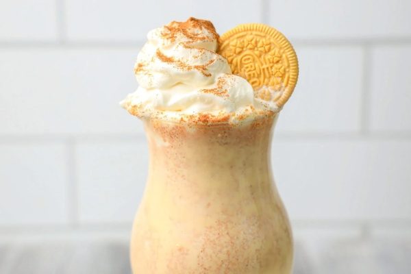 A delicious milkshake recipe featuring whipped cream and an oreo cookie.
