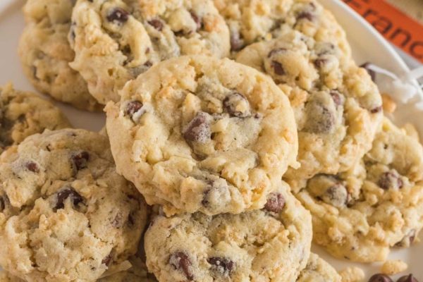 A stack of chocolate chip cookies on a plate.