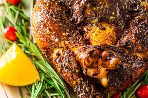 Roasted chicken with lemon on the side.